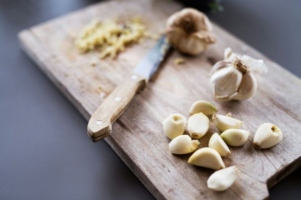 Garlic cloves for Asian chicken rice soup. Garlic is a great ingredient in a recipe for chicken bone broth soup.